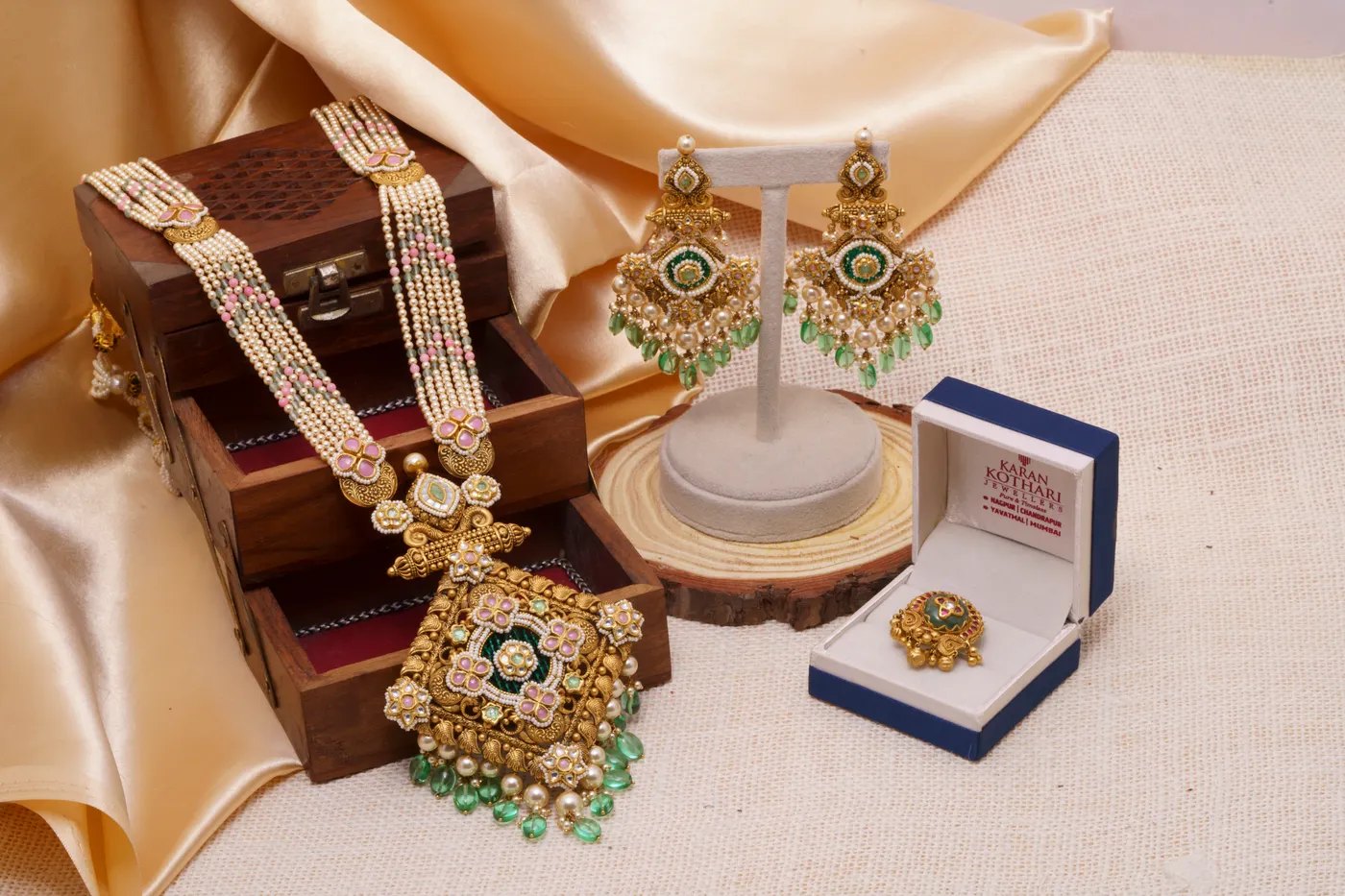 Indian bridal jewelry set with necklace, earrings and ring, shown whole